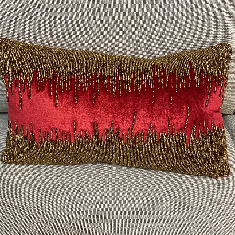 Gold metal beads lumbar pillow.